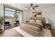 Bright bedroom with wood floors and access to a private balcony at 7575 E Indian Bend Rd # 2081, Scottsdale, AZ 85250