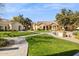 Community view with manicured lawns and building exteriors at 7575 E Indian Bend Rd # 2081, Scottsdale, AZ 85250
