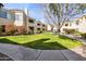 Community view with manicured lawns and building exteriors at 7575 E Indian Bend Rd # 2081, Scottsdale, AZ 85250