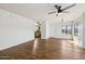 Living room with hardwood floors, access to balcony and kitchen at 7575 E Indian Bend Rd # 2081, Scottsdale, AZ 85250