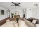 Living room with hardwood floors, stylish furniture and kitchen access at 7575 E Indian Bend Rd # 2081, Scottsdale, AZ 85250