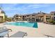 Relaxing community pool area with a covered patio at 7575 E Indian Bend Rd # 2081, Scottsdale, AZ 85250