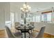 Open dining area with hardwood floors and built-in shelving at 7737 E Shooting Star Way, Scottsdale, AZ 85266