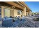 Extended patio with seating area, mountain views, and backyard access at 7737 E Shooting Star Way, Scottsdale, AZ 85266