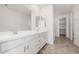 Bright bathroom with double sink and white cabinets at 18002 W Vogel Ave, Goodyear, AZ 85338