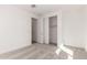 Empty bedroom featuring neutral carpet, closet, and natural light at 18002 W Vogel Ave, Goodyear, AZ 85338