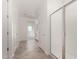 Hallway leading to a bathroom with glass shower at 18002 W Vogel Ave, Goodyear, AZ 85338