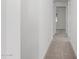 Hallway with neutral carpet at 18002 W Vogel Ave, Goodyear, AZ 85338