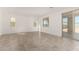 Bright living room with large windows and tile flooring, ideal for entertaining and relaxation at 18002 W Vogel Ave, Goodyear, AZ 85338