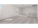 Bright loft space with carpet, white walls, and railing with horizontal bars at 18002 W Vogel Ave, Goodyear, AZ 85338