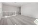 Spacious loft area with neutral carpet and railing with horizontal bars at 18002 W Vogel Ave, Goodyear, AZ 85338