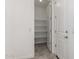 Walk-in pantry with built-in shelving and ample storage space at 18002 W Vogel Ave, Goodyear, AZ 85338