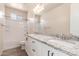 Bathroom featuring granite countertops and dual sinks with black hardware at 707 W Coles Rd, Phoenix, AZ 85041