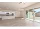 Spacious living room showcasing an open floor plan to the kitchen and sliding glass door to the backyard at 707 W Coles Rd, Phoenix, AZ 85041