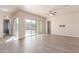 Open living room featuring wood-style flooring, ceiling fan, and sliding glass doors to the backyard at 707 W Coles Rd, Phoenix, AZ 85041