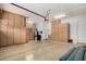 Spacious garage with ample storage cabinets and epoxy floor at 26747 N 127Th Dr, Peoria, AZ 85383
