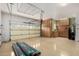 Garage with door, built-in cabinets, and ample space for parking and storage at 26747 N 127Th Dr, Peoria, AZ 85383