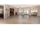 Bright living room featuring tile floors, a fireplace, built-in media center, and outdoor views at 26747 N 127Th Dr, Peoria, AZ 85383