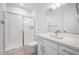 Stylish bathroom with a glass-enclosed shower and sleek vanity with modern fixtures at 8746 W Denton Ln, Glendale, AZ 85305