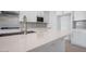 Modern kitchen features white cabinets, stainless steel appliances, and a stylish backsplash at 8746 W Denton Ln, Glendale, AZ 85305