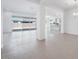 Spacious living room featuring an open floor plan with large sliding glass doors and bright white walls at 8746 W Denton Ln, Glendale, AZ 85305