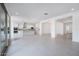 Expansive living room view showcasing an open-concept design with a modern kitchen and bright, airy atmosphere at 8746 W Denton Ln, Glendale, AZ 85305