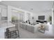 Open concept living room with tile floors, recessed lighting, and neutral decor, creating a welcoming space at 8746 W Denton Ln, Glendale, AZ 85305