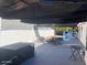 Private pool area with patio furniture and shade structure at 1563 S Pennington Dr, Chandler, AZ 85286