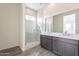 Modern bathroom with double vanity and large mirror at 17993 W Long Lake Rd, Goodyear, AZ 85338