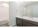 Bathroom with double vanity and tub at 17993 W Long Lake Rd, Goodyear, AZ 85338