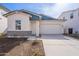 New construction home with two-tone exterior, attached garage, and landscaped front yard at 17993 W Long Lake Rd, Goodyear, AZ 85338