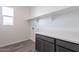 Laundry room with built-in cabinets and countertop at 17993 W Long Lake Rd, Goodyear, AZ 85338