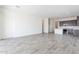 Bright and spacious living room with tile floors and sliding glass doors leading to the backyard at 17993 W Long Lake Rd, Goodyear, AZ 85338