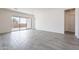 Bright and spacious living room with tile floors and sliding glass doors leading to the backyard at 17993 W Long Lake Rd, Goodyear, AZ 85338