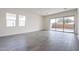 Bright and spacious living room with tile floors and sliding glass doors leading to the backyard at 17993 W Long Lake Rd, Goodyear, AZ 85338