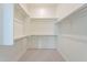 Spacious walk-in closet with ample shelving and rods at 17993 W Long Lake Rd, Goodyear, AZ 85338