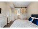 Main bedroom with sliding barn door and built-in dresser at 15603 N 79Th N Dr, Peoria, AZ 85382