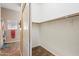 Walk-in closet with wood flooring and hanging rod at 15603 N 79Th N Dr, Peoria, AZ 85382