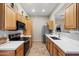 Galley style kitchen with stainless steel appliances and white countertops at 15603 N 79Th N Dr, Peoria, AZ 85382