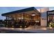 Modern restaurant entrance with glass windows and warm lighting, inviting guests inside at 6166 N Scottsdale Rd # C3006, Paradise Valley, AZ 85253