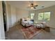 Bright bedroom with a comfortable bed, seating area, and large windows at 6202 E Mckellips Rd # 310, Mesa, AZ 85215