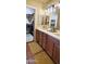 Bathroom with double sinks, a vanity, and a walk-in closet at 7027 N Scottsdale Rd # 237, Scottsdale, AZ 85253
