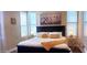 Bright bedroom with a plush bed and decorative artwork at 7027 N Scottsdale Rd # 237, Scottsdale, AZ 85253