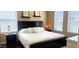 Elegant bedroom with a plush bed, dark wood furniture, and soft, natural lighting at 7027 N Scottsdale Rd # 237, Scottsdale, AZ 85253