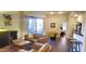 Open-concept living room with modern furniture, fireplace, and access to the patio at 7027 N Scottsdale Rd # 237, Scottsdale, AZ 85253