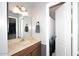 Well-lit bathroom with vanity, mirror, and accessible shower/tub combo at 1531 W Plana Ave, Mesa, AZ 85202