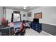 Comfortable bedroom with gaming setup, dresser, and stylish decor at 1531 W Plana Ave, Mesa, AZ 85202