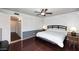 Spacious bedroom featuring hardwood floors, ceiling fan, and comfortable decor at 1531 W Plana Ave, Mesa, AZ 85202