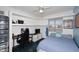 Inviting bedroom with built-in shelving, comfortable bed, and a bright window at 1531 W Plana Ave, Mesa, AZ 85202