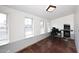 Bright bonus room with ample windows, unique flooring, and versatile space at 1531 W Plana Ave, Mesa, AZ 85202